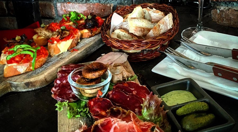 Charcuterie board, bruschetta and baguette